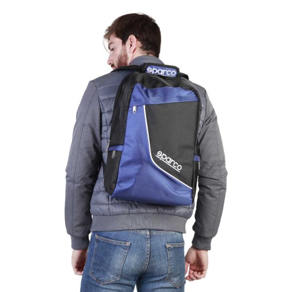 Sparco F12 Blue Backpack Bag Picture2: Sparco F12 is a medium-size backpack or travel bag with an adjustable shoulder straps, one padded compartment a top handle and more. The backpack has zipped closure with buckles and zipped side pockets. Sparco logo is printed at the front.